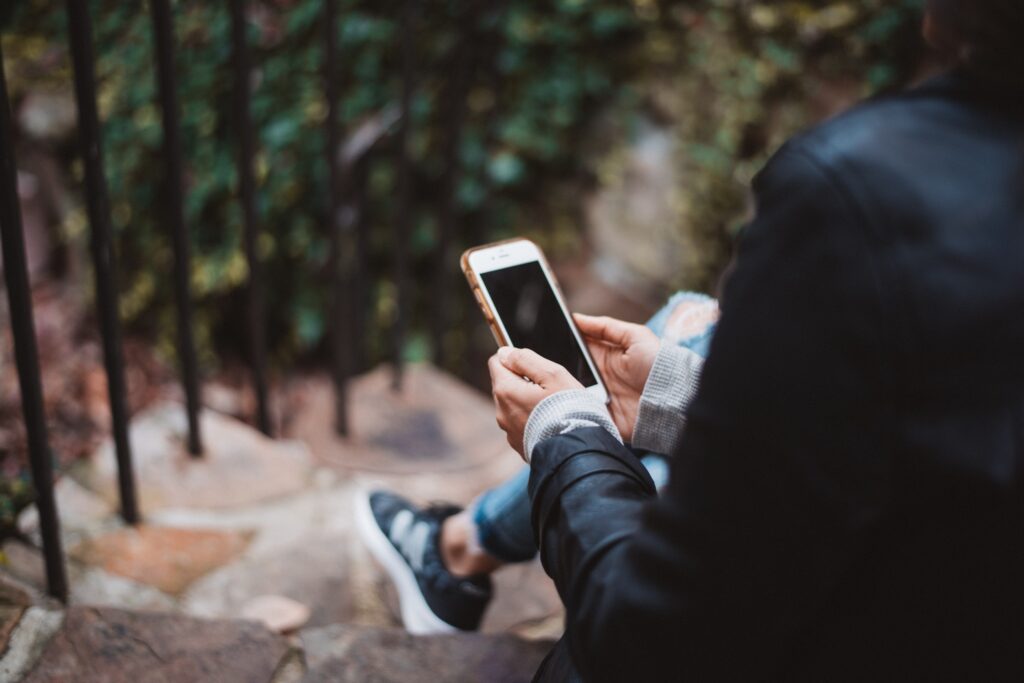 Person holding a mobile phone
