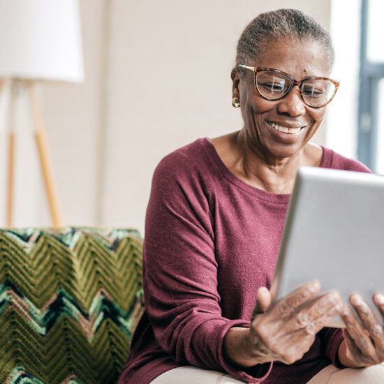 older woman looking at an ipad