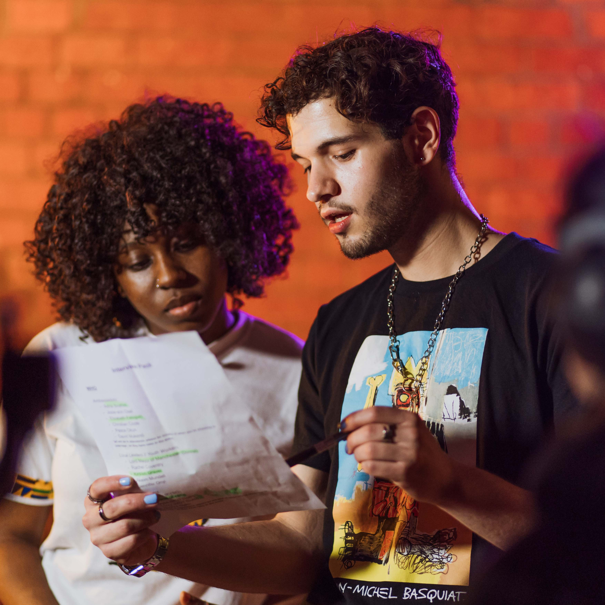 Two young people talking together.